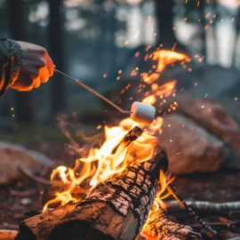 A man enjoying the benefits of time in nature by roasting marshmallows on a campfire