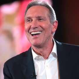 Howard Schultz, Starbucks's former CEO, smiling on stage