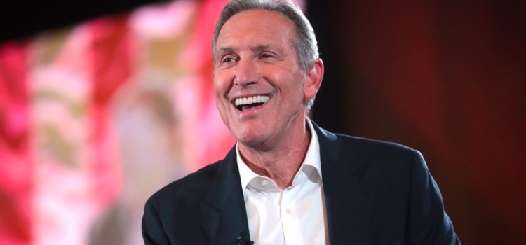 Howard Schultz, Starbucks's former CEO, smiling on stage