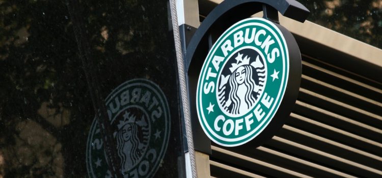 A Starbucks sign that represents Starbucks's business model