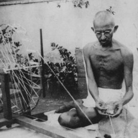 Mahatma Gandhi spinning yarn as part of the Khadi movement