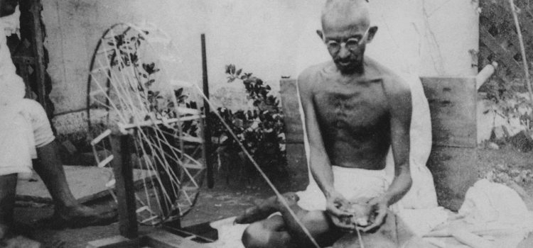 Mahatma Gandhi spinning yarn as part of the Khadi movement