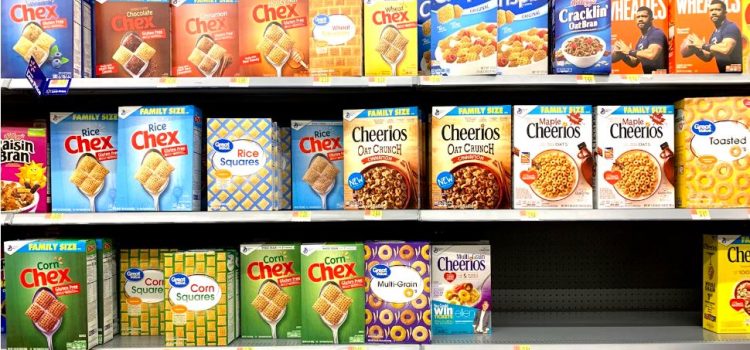 Boxes of cereal on a shelf in a grocery store signifying the lack of processed food regulations