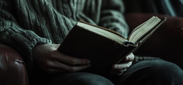 A person holding an open book