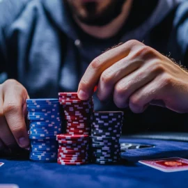 A poker player with a pile of chips in front of him illustrates how to calculate expected value