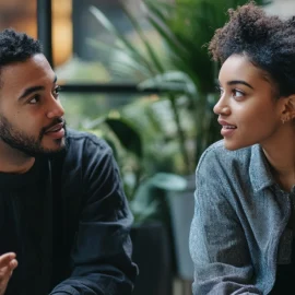 Two people talking to each other and showing the importance of knowledge sharing