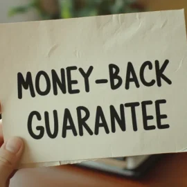 A person holding a piece of paper that says "Money-Back Guarantee"