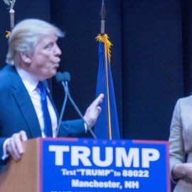 Donald Trump speaks at a presidential campaign event in New Hampshire on February 8, 2016, with Melania Trump