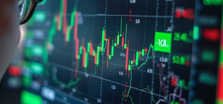 A person wearing glasses looking at a digital stock market chart illustrates stock picking vs. index funds