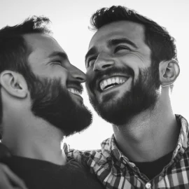 Two men smiling next to each other, showing how to maintain healthy relationships