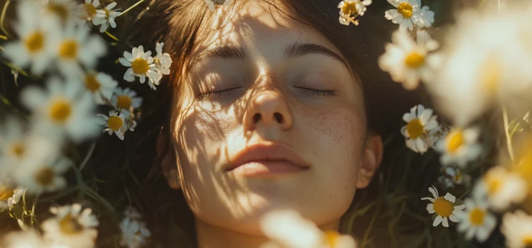 A woman laying in flowers, practicing spiritual self-care