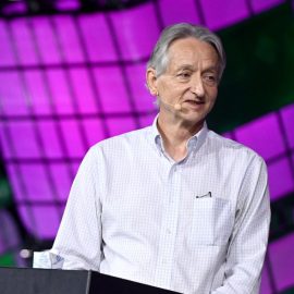 Geoffrey Hinton, the "Godfather of deep learning" standing at a podium