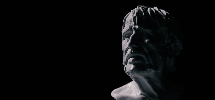 A bust of the Stoic philosopher Seneca against a black background