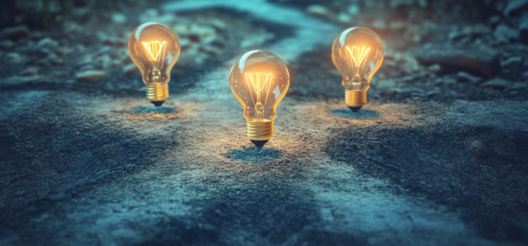 Light bulbs at crossroads with three paths going in different directions illustrates how to find insight