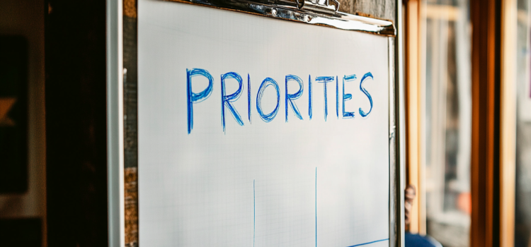 A whiteboard with the word "PRIORITIES" on it to show how to set priorities in life