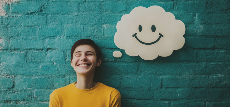 A person with a thought bubble shaped like a smiley face illustrates the link between positive thinking and motivation