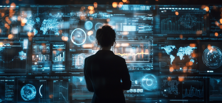 A woman in silhouette, seen from behind, looking at data on screens illustrates how to interpret data effectively